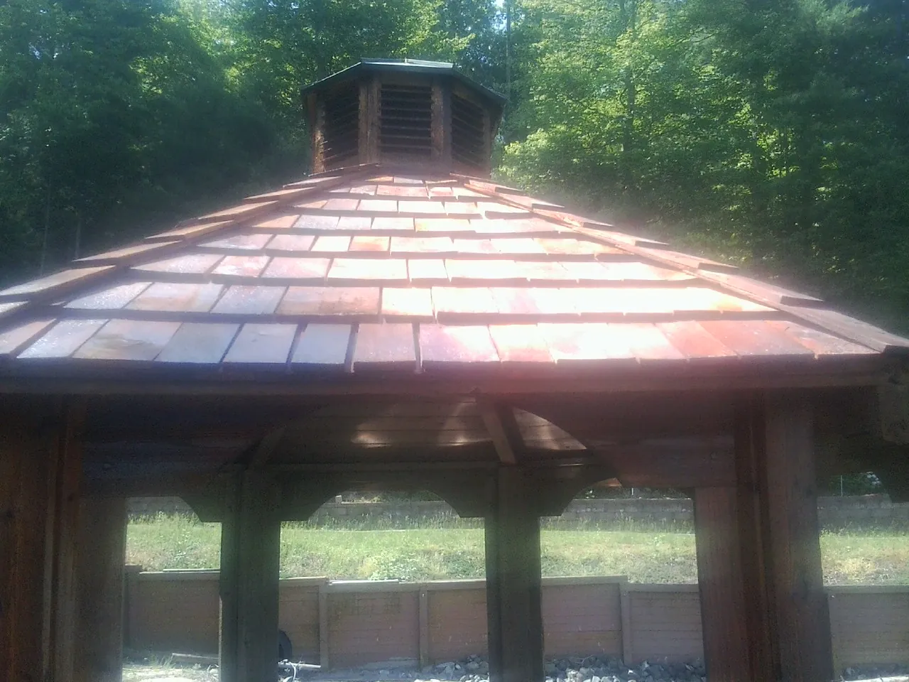 New cedar shake roof and cupola on a lakeside gazebo in Burlingame